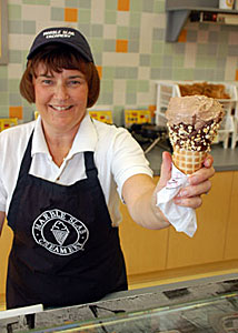 TRY THIS: Joan McCullough offers a cone of that frozen dairy product known as ice cream in her new shop Marble Slab Creamery. (Philip Alves/Vaughan Today)