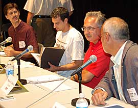 CALM BEFORE THE STORM: Green candidate Lloyd Helferty, left, appeared shocked at the friendly banter between PC Peter Shurman and Liberal Mario Racco before Tuesday's debate. Independent candidate Malcolm Kojokaro took the time to brush up on his notes before opening remarks. (Philip Alves/Vaughan Today)