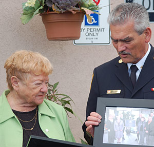 HONOURING A HERO: Elsie Milne, wife of fallen firefighter Donald (Chic) Milne, at the dedication ceremony of Station 7-2 with Fire Chief Greg Senay Monday. (Philip Alves/Vaughan Today)